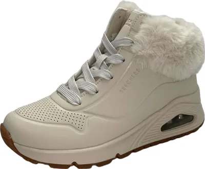 A single beige Skechers boot with white laces and faux fur trim, shown from the side against a white background.