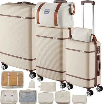 A collection of luggage and packing cubes arranged on a white background.
