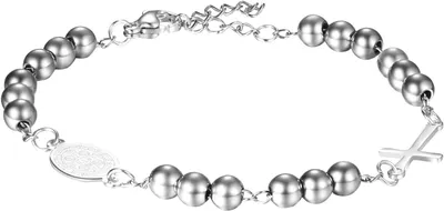 Imagen del producto de Pulsera de acero inoxidable con motivos religiosos, con una cruz latina y una medalla de San Benito, para mujeres