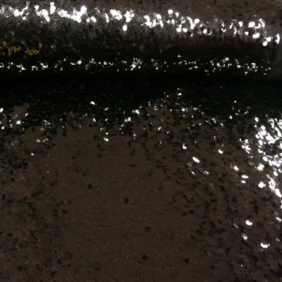 Produktbild von Stoff Meterware Pailletten lose schwarz 1,3m