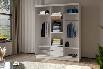 A white wardrobe with sliding doors is shown, organized with clothes, baskets, and bags.