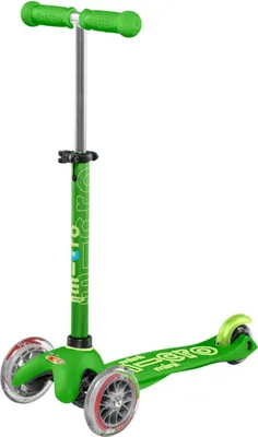 A green Micro Mobility Mini Micro Deluxe scooter is shown against a white background.