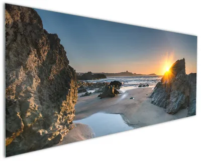 Produktbild von Wallario Küchenrückwand aus Glas, Größe: 125 x 50 cm, Motiv: Sonnenuntergang hinter einem Felsen am Strand | Spritzschutz | abwischbar | pflegeleicht | in