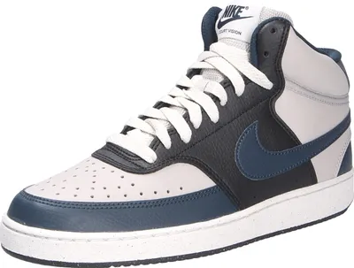 A studio shot of a single Nike sneaker.