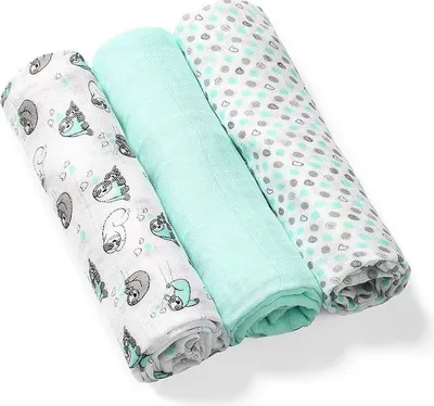 Three rolled-up baby blankets are displayed diagonally against a white background.