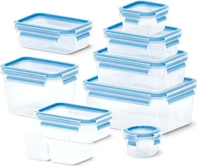 A collection of clear plastic food storage containers with blue lids and latches, arranged on a white background.