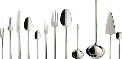 A collection of silverware laid out on a white background.