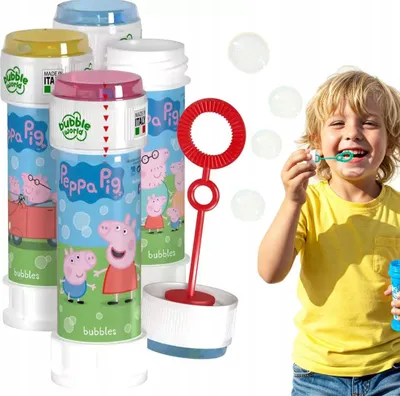 A child is blowing bubbles from a bottle of Peppa Pig branded bubble solution.