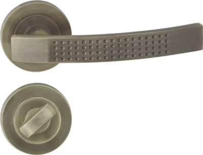 Produktbild von DOMINO Türgriff Drückergarnitur WC - Badezimmer Set | Rund-Rosette | Türbeschlag für Badezimmertüren | Set WC - Rosetten-Garnitur | Türklinke aus Aluminium | Bronze Türdrückergarnitur | ALMA-R ECO M3