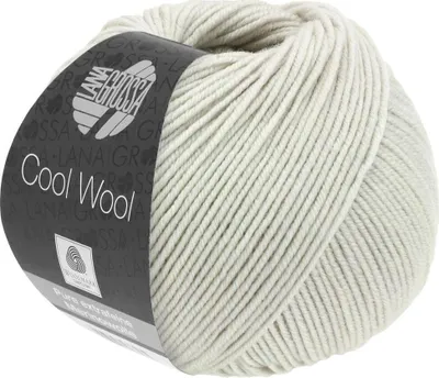 A ball of light gray yarn with a label.