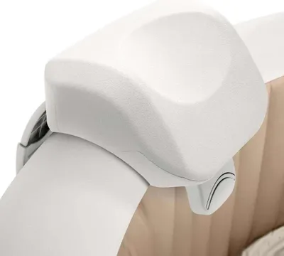 A close-up view of a white headrest for a spa or inflatable pool.