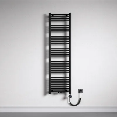 A black electric towel radiator mounted on a textured white wall, with a coiled power cord plugged into a wall socket.