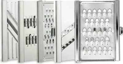 A close-up, studio shot of a multi-functional vegetable slicer with various attachments.
