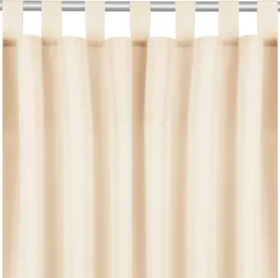A close-up view of a beige curtain hanging from a rod.