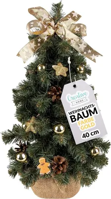 A decorated mini Christmas tree on a white background with a product tag.