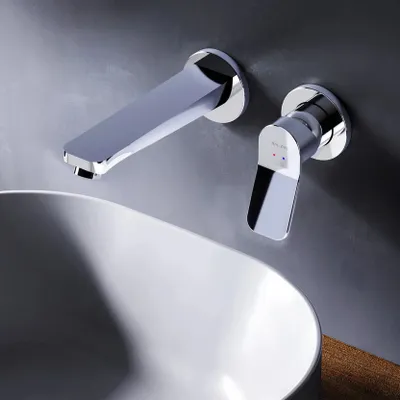 A modern bathroom sink with a wall-mounted faucet.