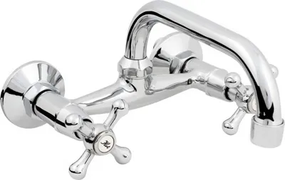 A chrome-finished wall-mounted faucet with two cross-shaped handles and a curved spout.