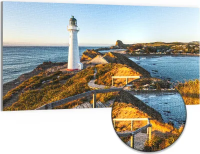 Produktbild von DEQORI Hybrid Leinwand Bild 100x50 cm 'Leuchtturm Idylle' Wandbild Glas flach modern