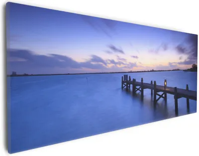 Produktbild von Wallario Premium Leinwandbild Steg bei Abenddämmerung - Blauer Himmel bei Nacht in Größe 30 x 75 cm