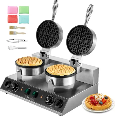 A commercial double-headed waffle maker with accessories and a finished waffle on a plate.