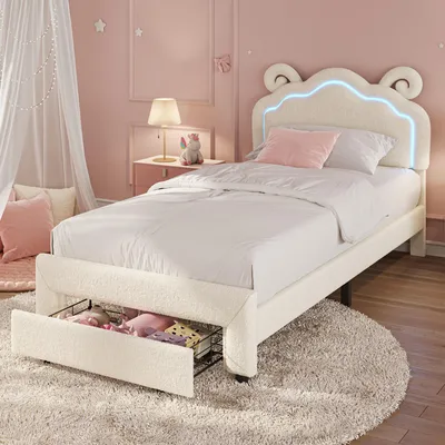 Productafbeelding van UnboxG kinderbed, 90x200 cm, met LED-verlichting, bekleding van teddy stof en een schapendesign aan het hoofdeinde. Enkelbed met lade en opbergruimte, inclusief lattenbodem