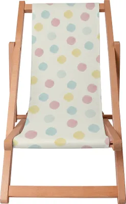 A wooden deck chair with a pastel polka dot fabric.