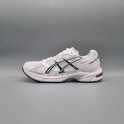 A side view of a single white Asics running shoe with black accents against a plain gray background.