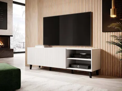 A modern living room with a TV stand and a large television.