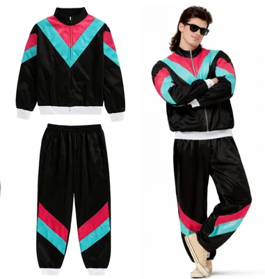 A man wearing an 80s/90s style tracksuit, with a separate tracksuit laid out.