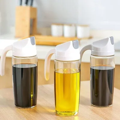 Zdjęcie produktu dla Zestaw butelek na olej, 2 sztuki po 600 ml, szklane, z automatycznymi pokrywkami, biało-szare