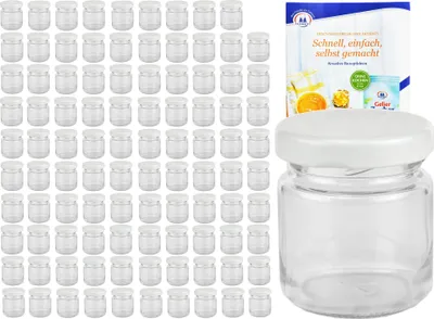 A set of small glass jars with white lids, along with a recipe booklet.