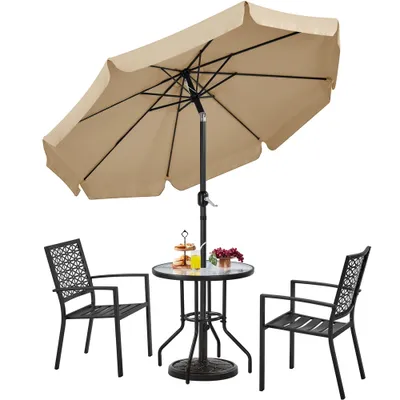 A patio umbrella and table set with two chairs.