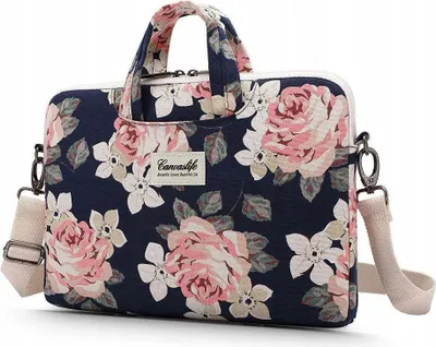 A navy blue laptop bag with a floral pattern of pink and white roses.