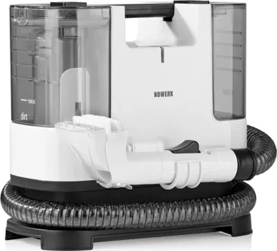 A white and gray carpet cleaner with a hose and attachments, shown on a white background.