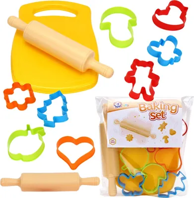 A baking set with a cutting board, rolling pin, and various shaped cookie cutters, some of which are in a plastic bag.
