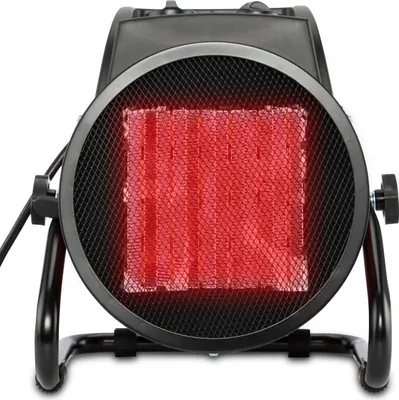 A close-up front view of a black electric heater with a glowing red heating element.