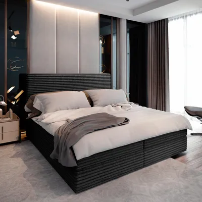 A bedroom scene with a bed as the main focus.