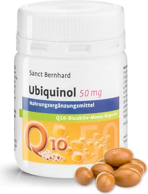A bottle of Sanct Bernhard Ubiquinol 50 mg supplements with some capsules scattered in front.
