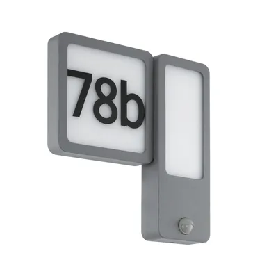 A gray house number sign with integrated LED light and motion sensor, mounted on a white background.