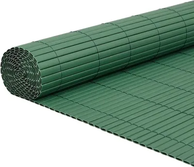 A rolled-up green PVC garden fence is shown against a white background.