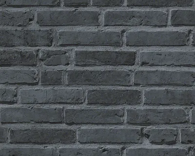A close-up view of a dark gray brick wall.