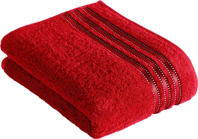 A folded red towel with decorative stripes.