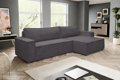 A dark gray sectional sofa is shown in a modern living room setting.