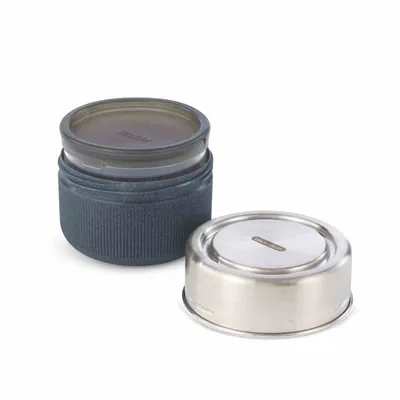 A glass lunch container with its lid separated, shown on a white background.