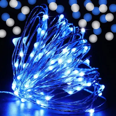 A close-up of a tangled string of blue LED lights with a dark background and out-of-focus blue and white circles.