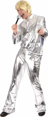 A man wearing a silver disco costume and holding a microphone.