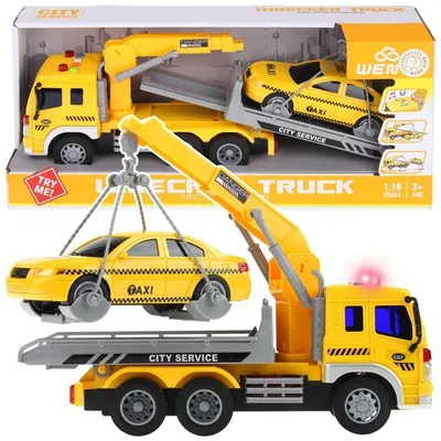 A toy wrecker truck with a taxi on a trailer, displayed in its packaging.