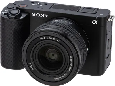 A close-up of a black Sony camera with a lens attached, shown from a three-quarter angle.