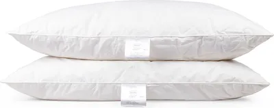 Two white pillows stacked on top of each other against a white background.