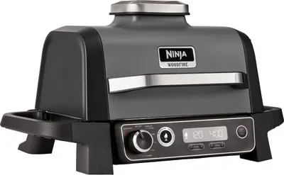 A studio shot of a Ninja Woodfire Outdoor Grill.